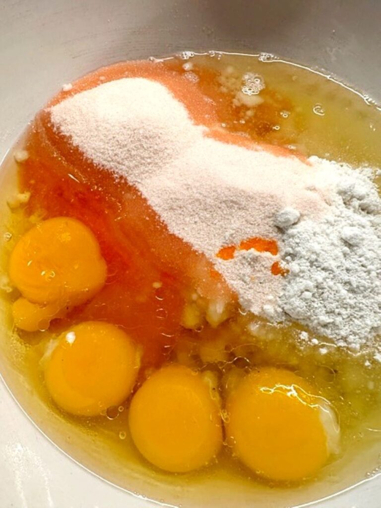 peach cake ingredients in a bowl