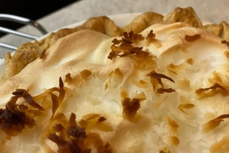close up of meringue on coconut pie