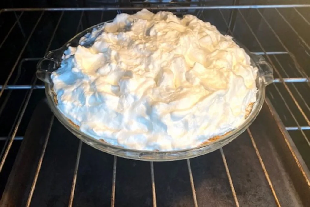 top the pie with meringue and bake in a hot oven