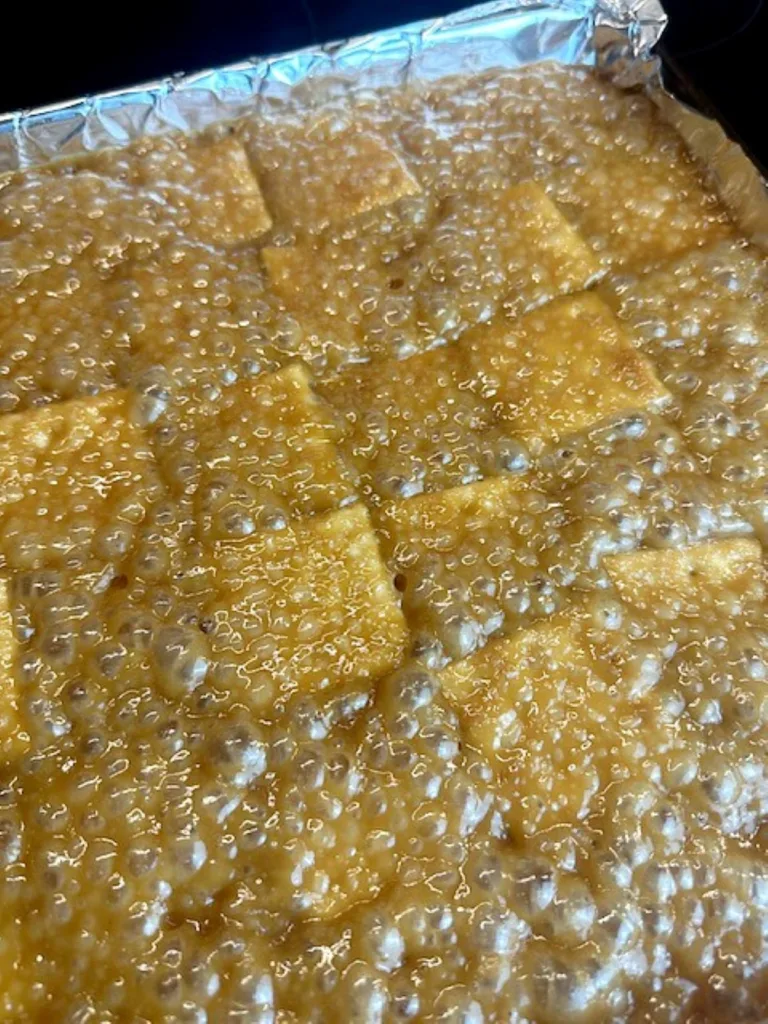 caramel topped crackers ready for bacon