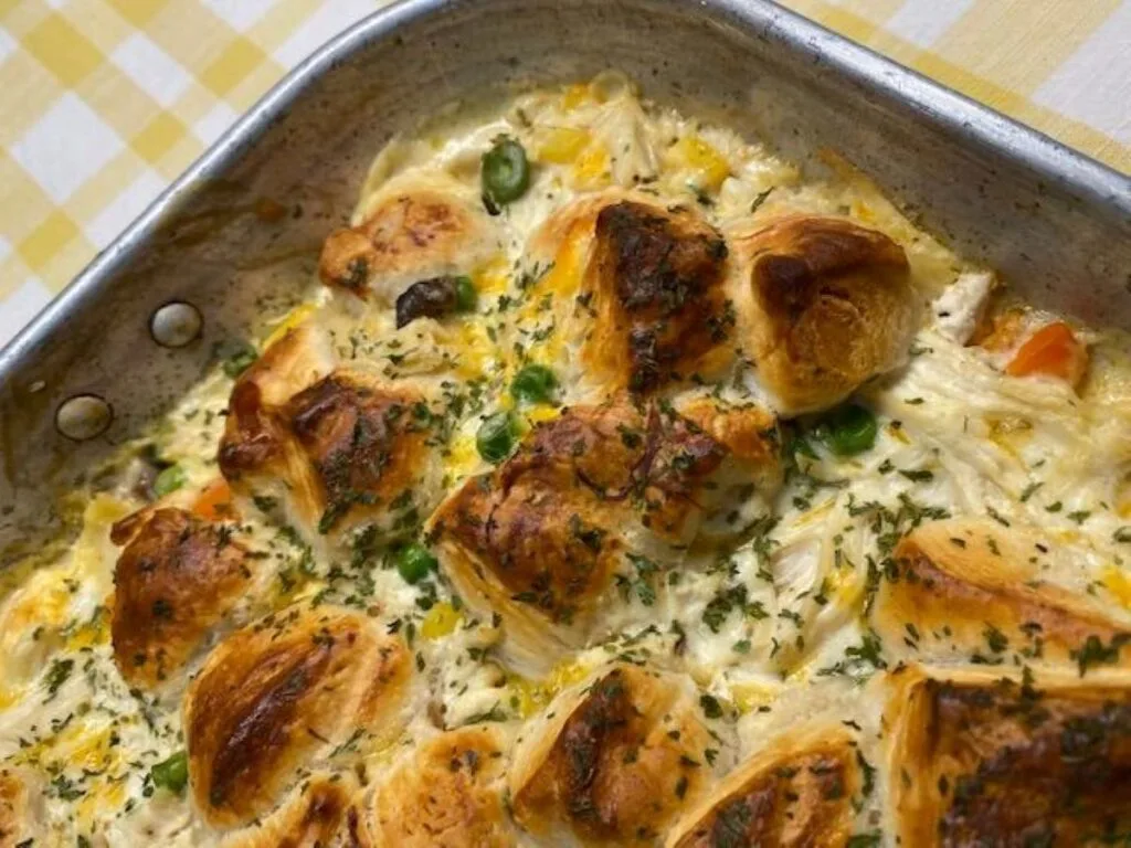hot bubbly chicken  and biscuit pot pie casserole topped with golden brown biscuits