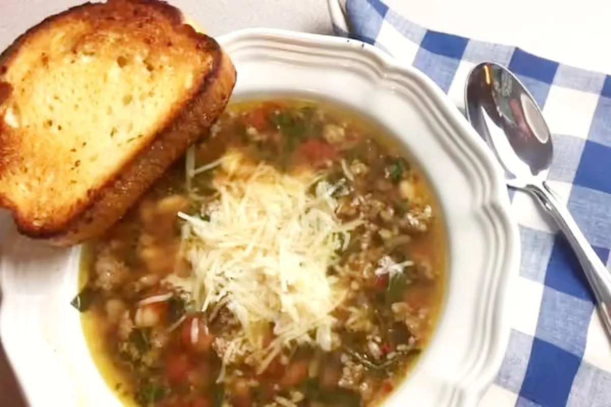 Rustic Italian sausage soup with tomatoes, spinach, and pasta in a savory broth — an easy, hearty meal for chilly nights.