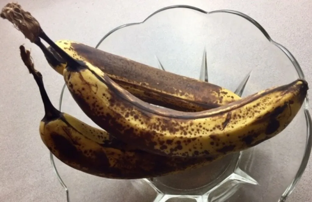 three perfectly ripened bananas, ready to bake into bread