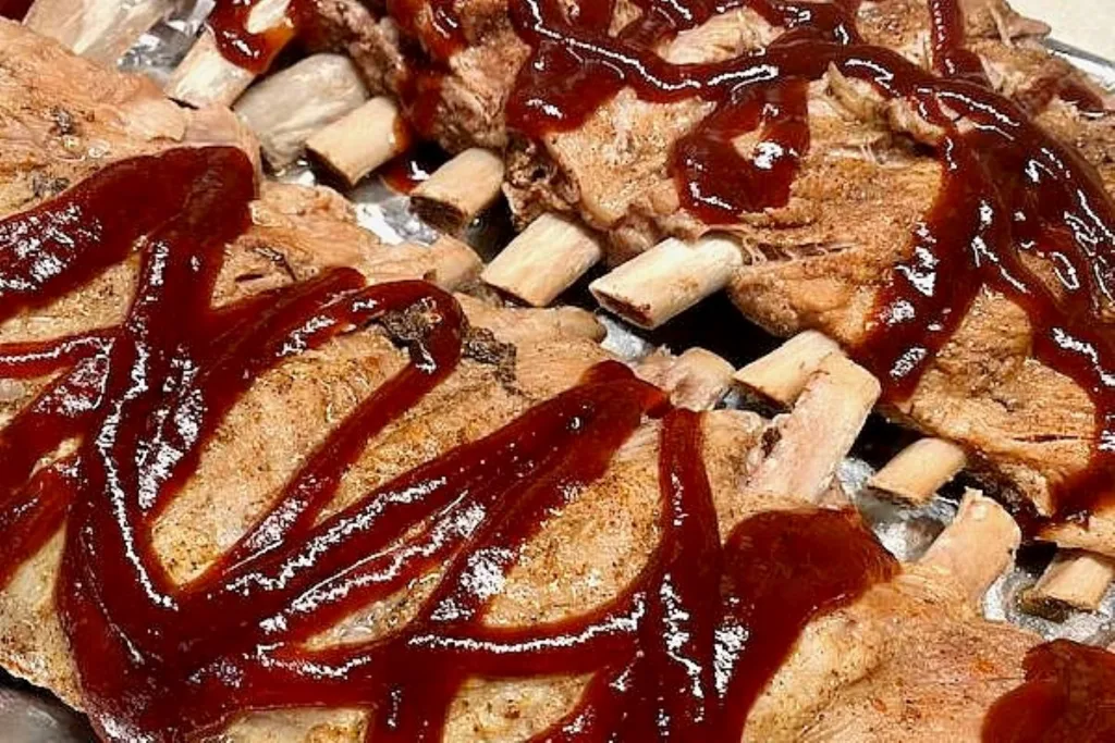 cooked spare ribs ready for the oven