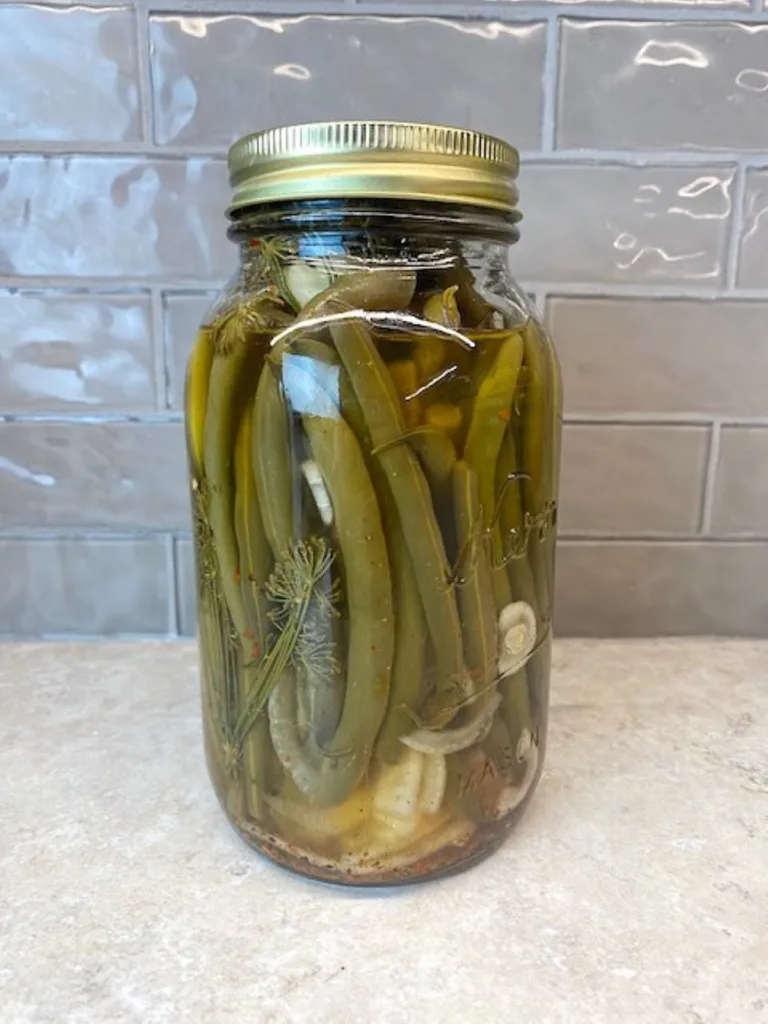 a quart jar filled
 with refrigerator dilly beans
