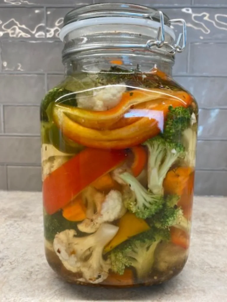 a big jar of colorful crunchy mixed vegetable refrigerator pickles