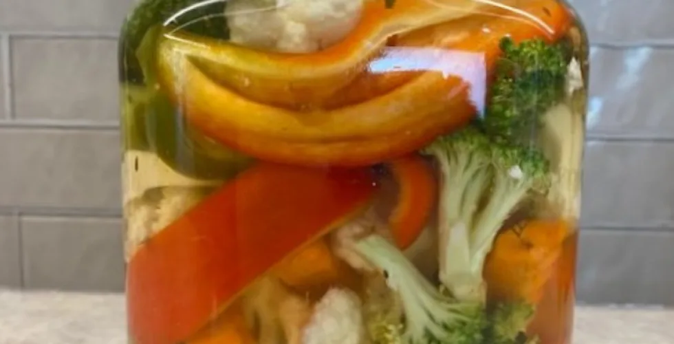 a big jar of colorful crunchy mixed vegetable refrigerator pickles